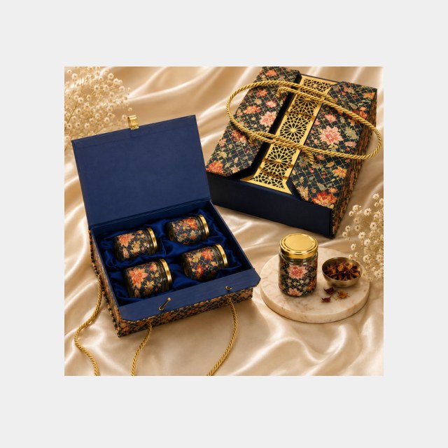 Navy floral Diwali box opened flat to show four compartments of assorted dry fruits