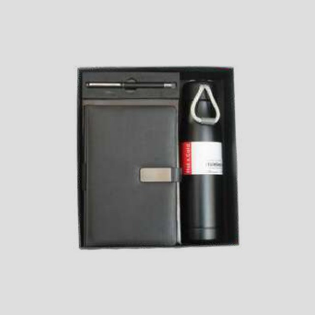 Black notebook with insulated bottle, metal pen and bottle-opener keychain in a fitted box