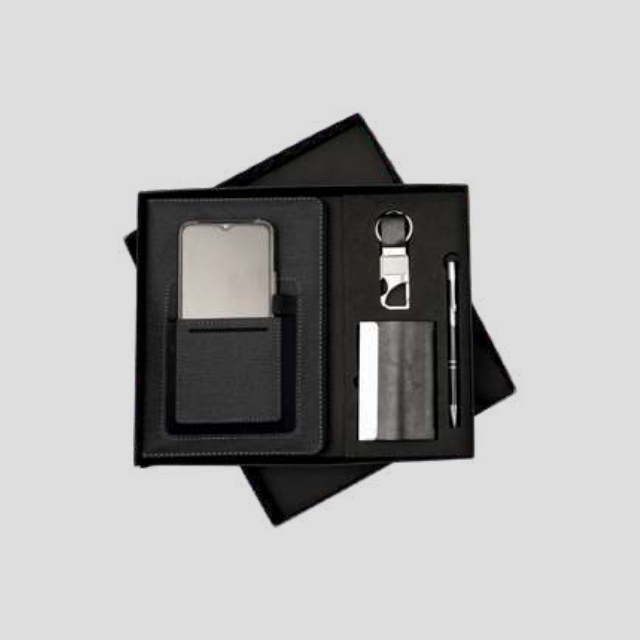 Three-piece gift set with metal card holder, leather-strap keychain and metal pen