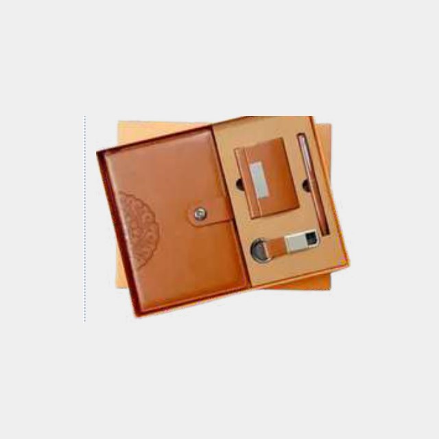 Tan leather notebook with metal button closure, matching card holder and metal pen