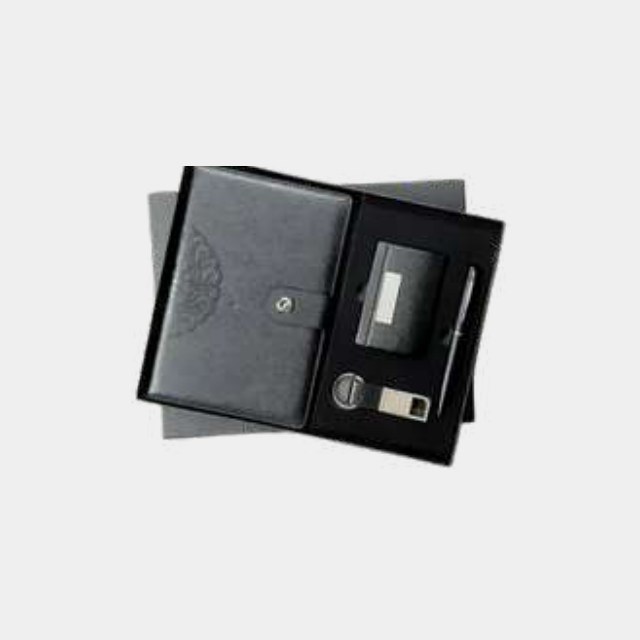 Charcoal A5 notebook with embossed medallion cover, metal pen and keychain