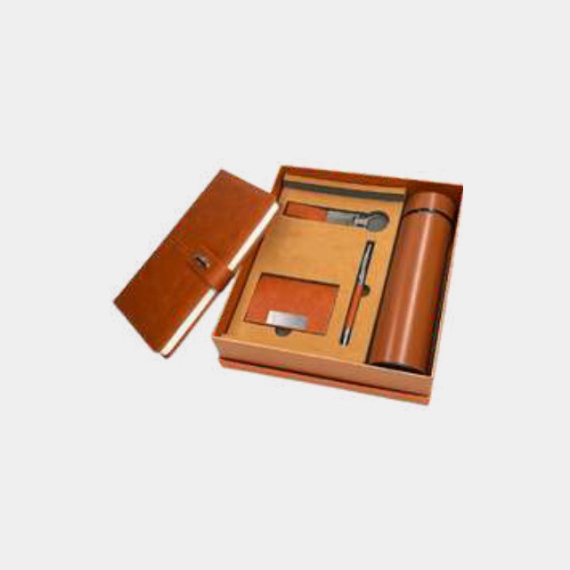Tan leather notebook with metal pen and keychain in a colour-matched tan gift box