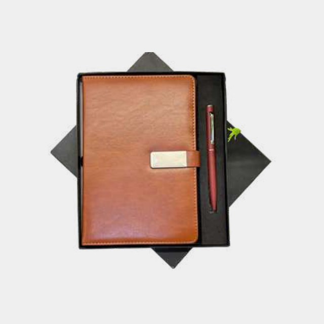 Tan leather A5 notebook with a burgundy-barrel metal pen