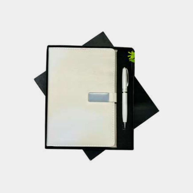 Cream A5 notebook with a slim silver metal pen on a presentation board