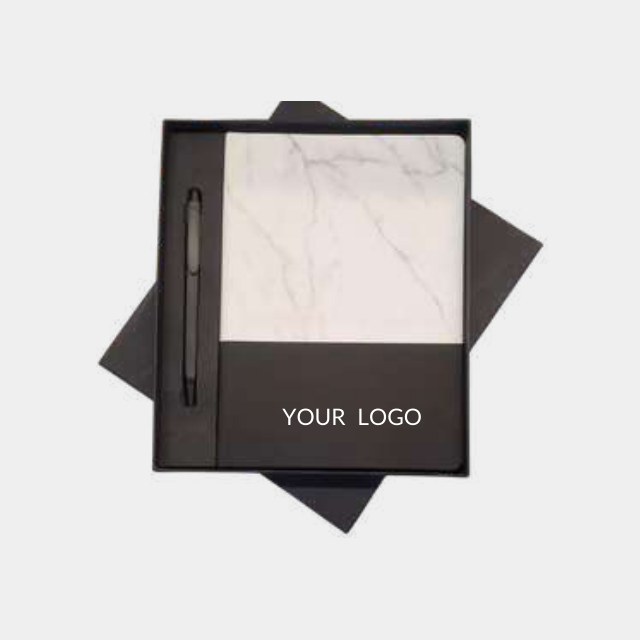 White marble-effect notebook with a black logo band and a slim metal pen