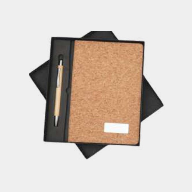 Full cork-cover notebook with brushed metal logo plate and a turned wooden pen