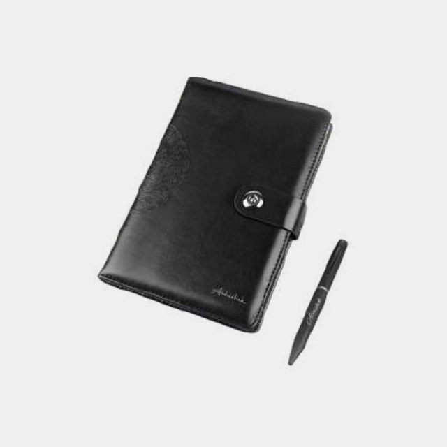 Compact black leather notebook with snap-stud closure and a matching black metal pen