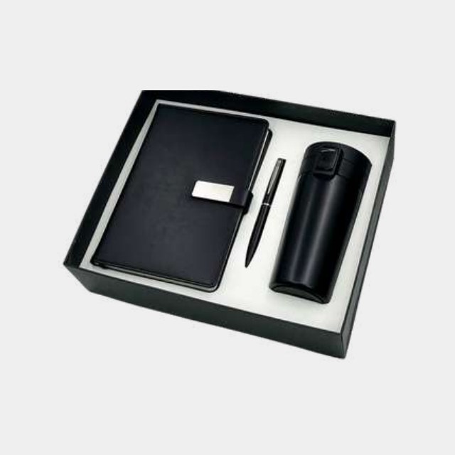 Black leather notebook with insulated bottle and metal pen in a white-lined presentation tray