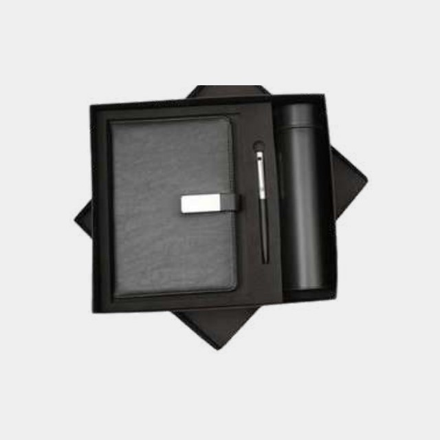 Black elastic-closure notebook with insulated bottle and metal pen in a fitted tray