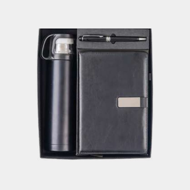 Tall vacuum flask with charcoal notebook and metal pen in a fitted tray