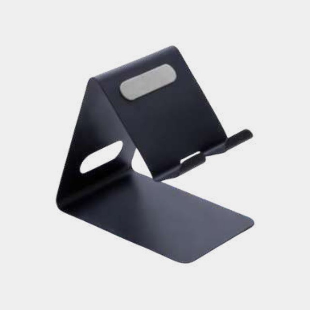 Solid navy anodised aluminium phone stand with a cable cut-out