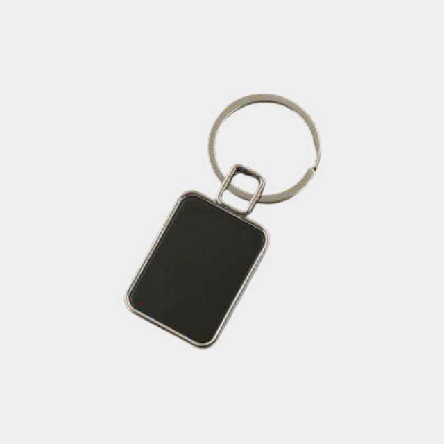 Matte black rectangular metal keychain on a split ring