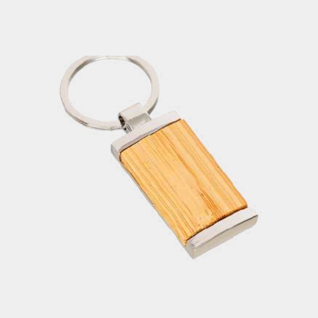 Rectangular light-wood keychain with a metal trim edge and engraved face