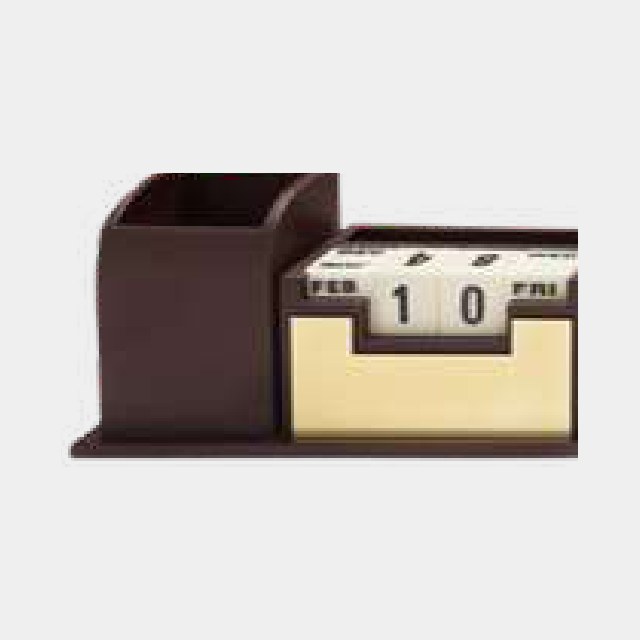 Brown wood desk organizer with recessed perpetual calendar blocks and a pen well