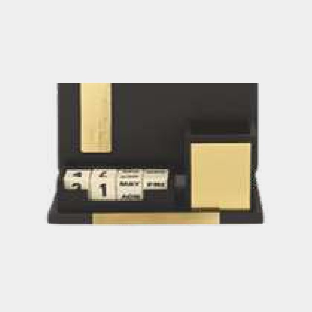 Black desk organizer with perpetual calendar blocks and gold-toned accessory trays